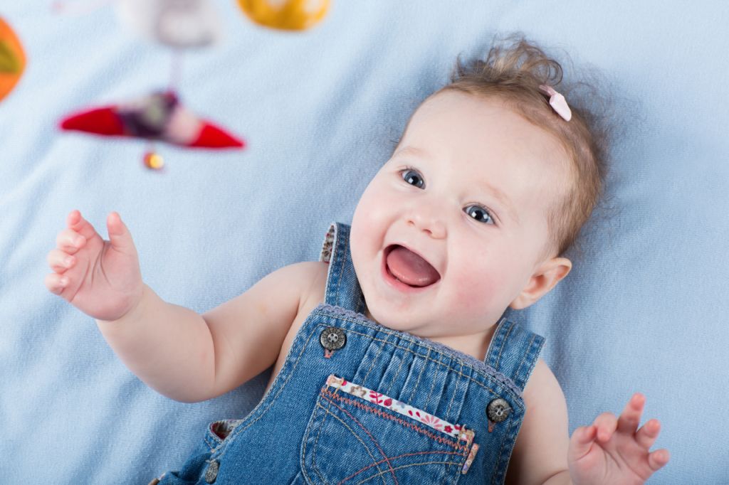 happy-baby-playing-with-mobile