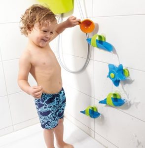 Image of little child playing with the Haba Bathtub Ball Track Set